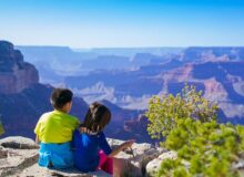 Two children looking into the Grand Canyon in Arizona