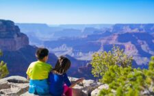Two children looking into the Grand Canyon in Arizona