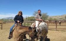 Two people on horseback at Tanque Verde Ranch in Tucson, Arizona