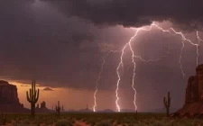 Arizona Monsoon Season with mountains, lightning and saguaro